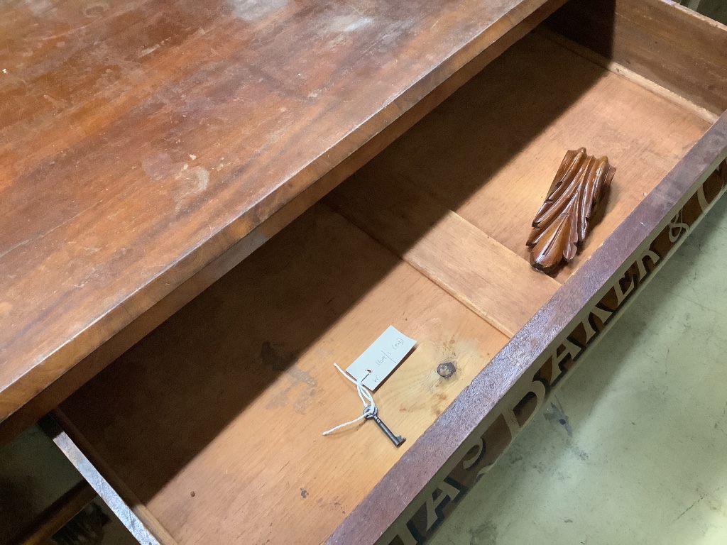 A tailor's bespoke carved mahogany shop cabinet, fitted two panelled doors, inscribed to the front in gilt lettering